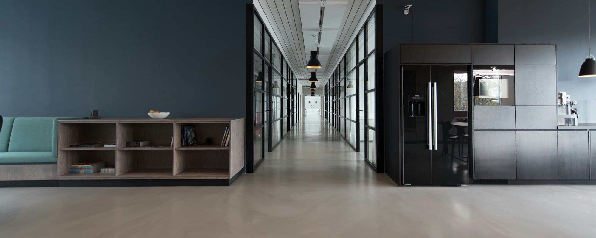Refined creative studio workspace with designers working in natural daylight
