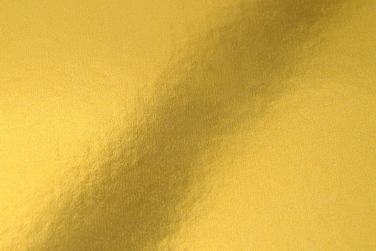 Close-up of embossed gold foil detail on premium print